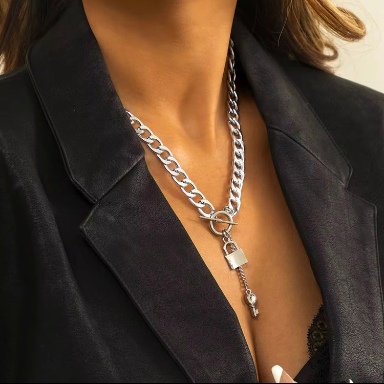Add a touch of edge to your look with our Lock & Key Chain Necklace. The thick cuban link design is both bold and stylish, while the unique lock and key feature adds a touch of romance. A must-have statement piece for any fashionista.
Made to last!
Tarnish and Water Resistant, Hypoallergenic
18 inches long
18k Gold PVD Plated over 316L Stainless Steel base.