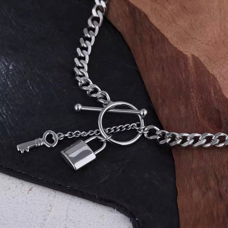 Add a touch of edge to your look with our Lock & Key Chain Necklace. The thick cuban link design is both bold and stylish, while the unique lock and key feature adds a touch of romance. A must-have statement piece for any fashionista.
Made to last!
Tarnish and Water Resistant, Hypoallergenic
18 inches long
18k Gold PVD Plated over 316L Stainless Steel base.