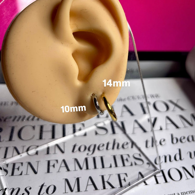Upgrade your earring game with our Tiny Hoops Earrings. Their perfect size allows you to stack them up for multiple piercings or wear them as a single huggie, adding effortless style to any look.
Made to last! Non Tarnish and Water Resistant, Hypoallergenic
10 mm diameter
14 mm diameter
18K Gold Plated over 316L Stainless Steel base