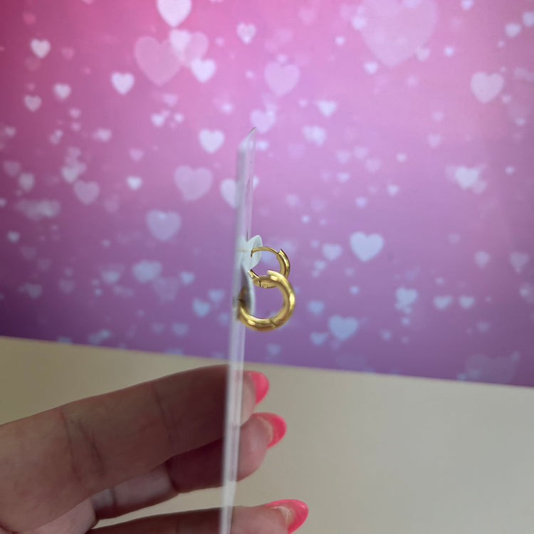 Upgrade your earring game with our Tiny Hoops Earrings. Their perfect size allows you to stack them up for multiple piercings or wear them as a single huggie, adding effortless style to any look.
Made to last! Non Tarnish and Water Resistant, Hypoallergenic
10 mm diameter
14 mm diameter
18K Gold Plated over 316L Stainless Steel base