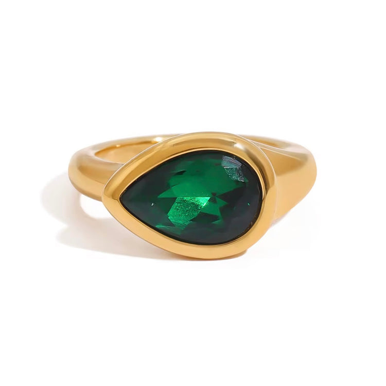 Expertly designed, the Ivy Ring features a stunning tear-shaped deep green gemstone that adds a modern statement to any ensemble. Crafted with precision and style, this accessory exudes elegance and sophistication, making it a must-have for any fashion-forward individual.
Green Zircon
Stainless Steel 18K Gold PVD Plated - Made to last!
Hypoallergenic, Tarnish free Beach & Pool Friendly