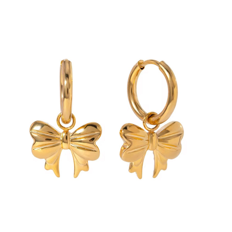 Embrace the latest trend with our must-have Bow Huggies Earrings. These cute accessories add a touch of charm to any outfit. Expertly crafted and designed to hug the ear, they are the perfect addition to your jewelry collection.
Made to last! Tarnish and Water Resistant, Beach & Shower friendly, Hypoallergenic
.82" total length from the hoop the the tip of the bow
18K Gold Plated over 316L Stainless Steel base