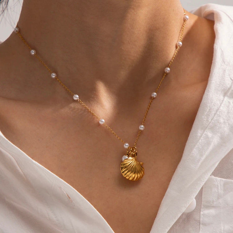 Discover the perfect accessory for any beach lover with our Under the Sea Necklace. This beachy necklace will transport you to forever summer vibes with its charming shell, starfish, and pearl charms. Embrace your inner mermaid and add a touch of whimsy to any outfit.
.
Made to last! Tarnish and Water Resistant, Hypoallergenic
16" long +2" ext
Closure : Lobster Clasp
18k Gold PVD Plated over 316L Stainless Steel base