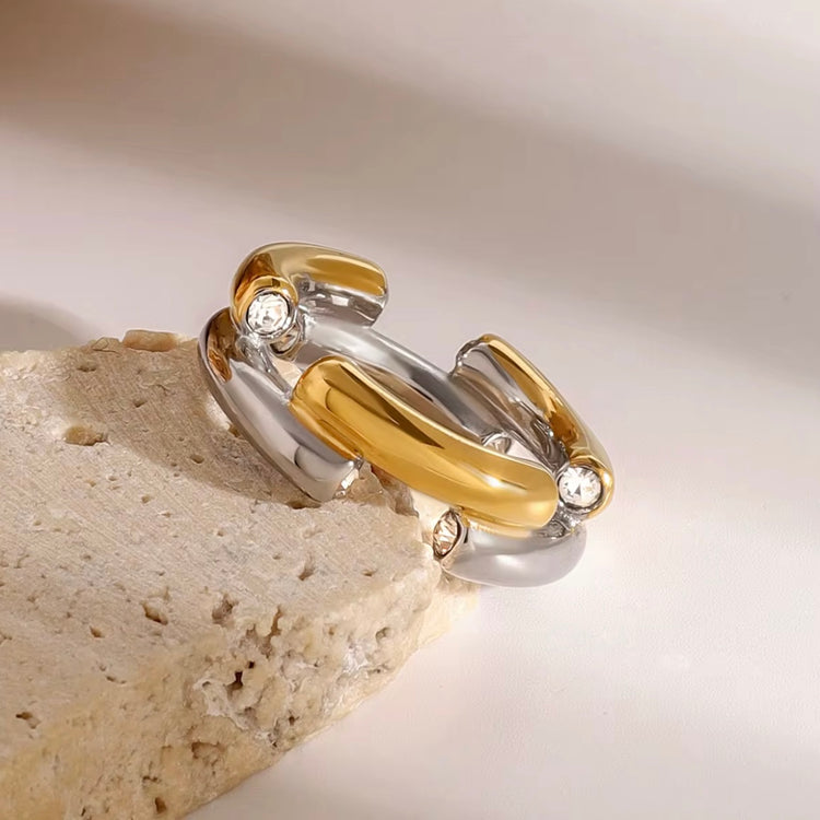 The Angelika Open Band Ring is a stunning embodiment of modern elegance and sophistication. With a seamless blend of gold and silver tones, this ring exudes luxury and versatility. Made with a durable and comfortable design, it is the perfect statement piece for any occasion.
Metal: Stainless Steel
Hypoallergenic & Water Resistant
Size: 7 only