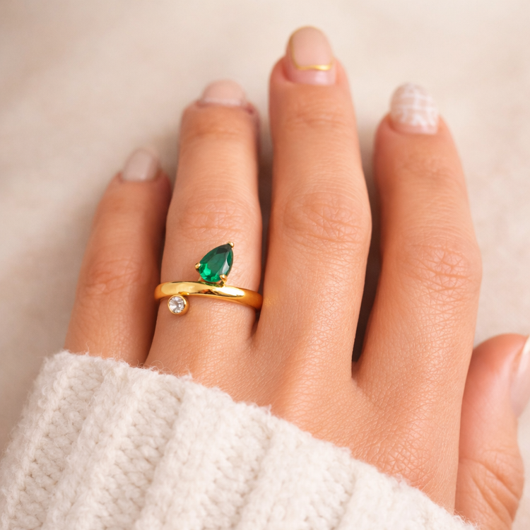 Gold pear-cut emerald ring on model hand, waterproof jewelry by XMTX Collections