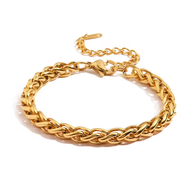 The Paola Bracelet boasts a timeless woven design and is crafted to resist tarnishing, ensuring its elegance and quality lasts for years to come. Exude sophistication and effortless style with this beautiful accessory.
316L Stainless Steel 18K PVD Gold Plated
6.5 inches long +2" inches ext