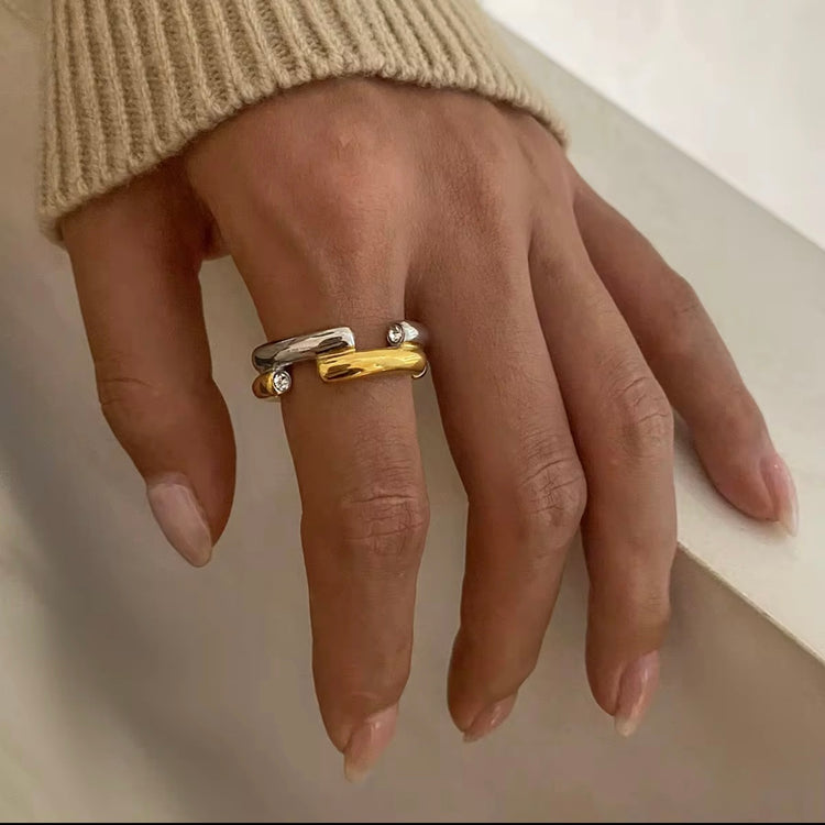 The Angelika Open Band Ring is a stunning embodiment of modern elegance and sophistication. With a seamless blend of gold and silver tones, this ring exudes luxury and versatility. Made with a durable and comfortable design, it is the perfect statement piece for any occasion.
Metal: Stainless Steel
Hypoallergenic & Water Resistant
Size: 7 only