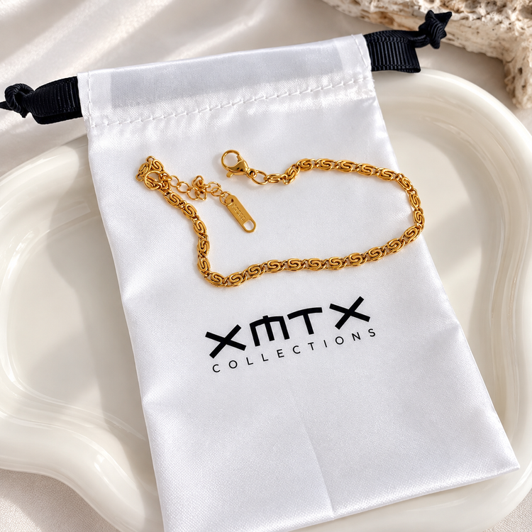 Thea dainty gold bracelet with XMTX Collections pouch