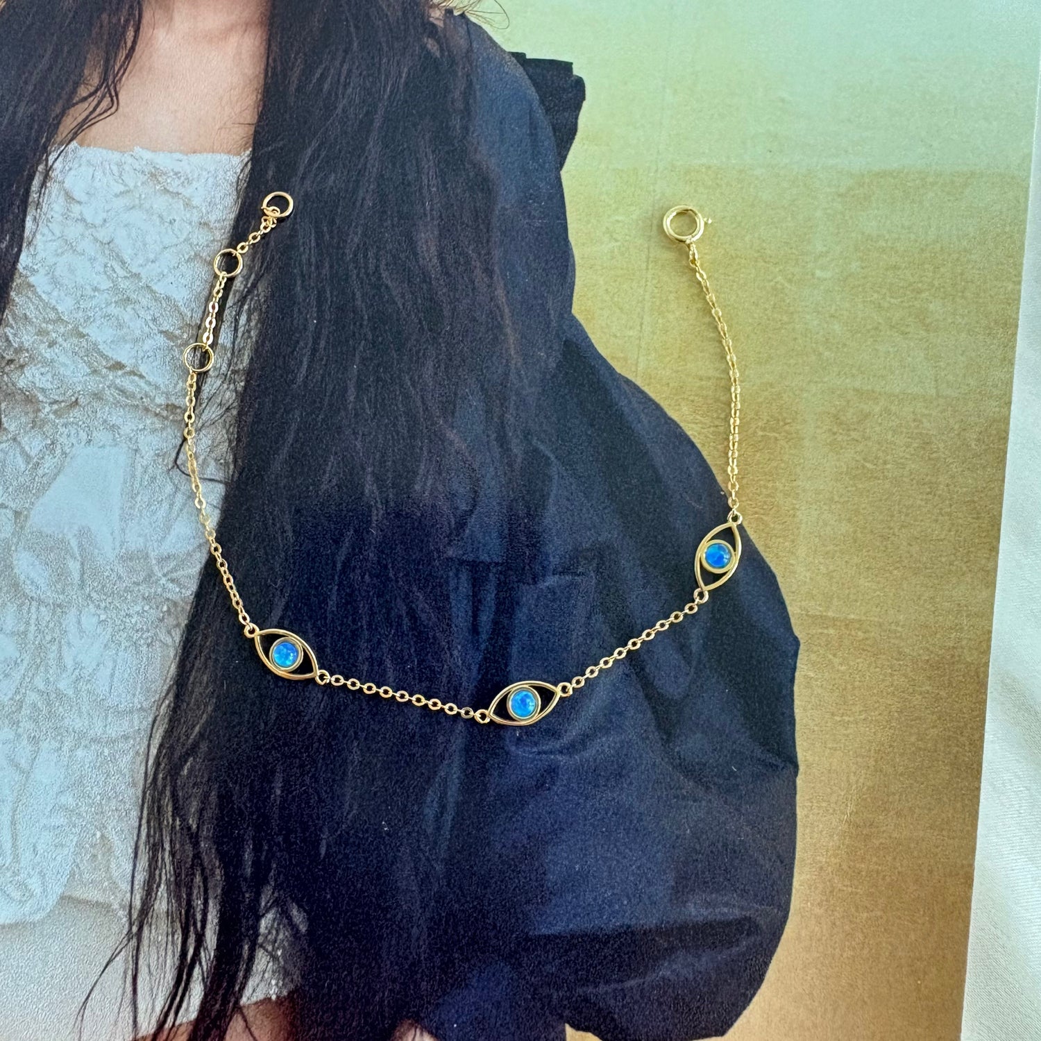 Minimalist blue opal evil eye bracelet editorial styling