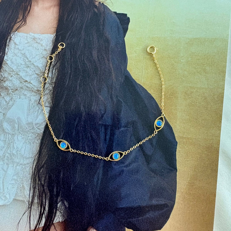 Minimalist blue opal evil eye bracelet editorial styling