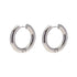 Indulge in the timeless elegance of our Celine Silver Hoop Earrings. Classic and must-have, these earrings are the perfect addition to any outfit. Elevate your style and make a statement with these exquisite hoops. You won&
