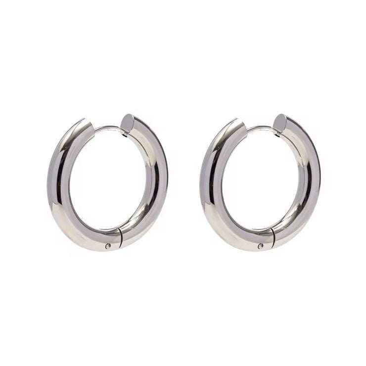 Indulge in the timeless elegance of our Celine Silver Hoop Earrings. Classic and must-have, these earrings are the perfect addition to any outfit. Elevate your style and make a statement with these exquisite hoops. You won't want to take them off!

Made to last! 

Tarnish and Water Resistant, Beach & Shower friendly, Hypoallergenic

23mm x 23mm 

316L Stainless Steel 

 

 