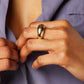 The Remi Ring boasts a unique arc shape, making it a bold statement piece for any outfit. Crafted with expert precision, this ring offers a sleek and modern design for those seeking a sophisticated accessory.&nbsp;

Stainless Steel 18K Gold PVD Plated - Made to last!

Hypoallergenic, Tarnish free Beach &amp; Pool Friendly