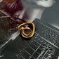 Cassie ring flat lay gold modern ring