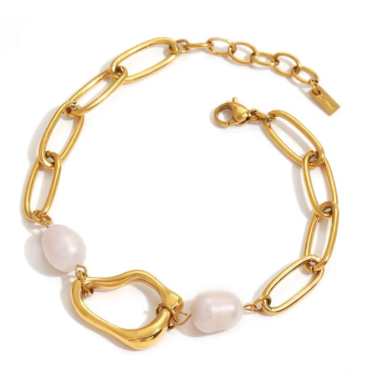 Coralie bracelet featuring chunky gold chain links and freshwater pearls