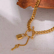 Add a touch of edge to your look with our Lock & Key Chain Necklace. The thick cuban link design is both bold and stylish, while the unique lock and key feature adds a touch of romance. A must-have statement piece for any fashionista.

Made to last! 

Tarnish and Water Resistant, Hypoallergenic

 

18 inches long 

 

18k Gold PVD Plated over 316L Stainless Steel base.  

 

 