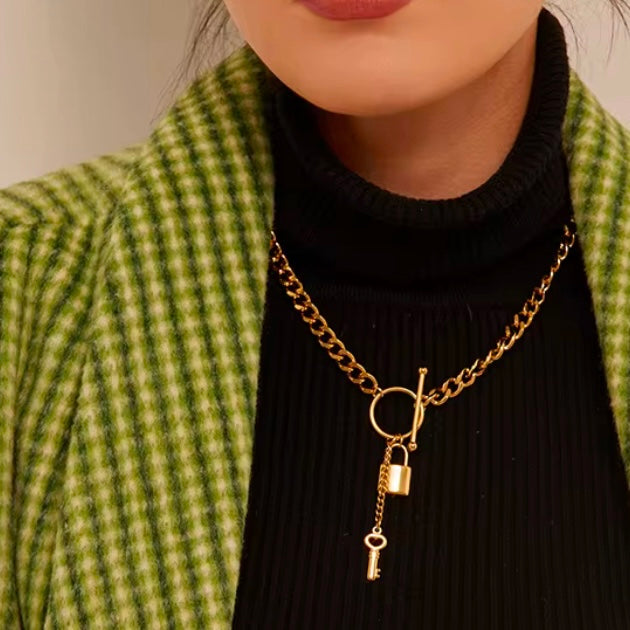 Add a touch of edge to your look with our Lock & Key Chain Necklace. The thick cuban link design is both bold and stylish, while the unique lock and key feature adds a touch of romance. A must-have statement piece for any fashionista.

Made to last! 

Tarnish and Water Resistant, Hypoallergenic

 

18 inches long 

 

18k Gold PVD Plated over 316L Stainless Steel base.  

 

 