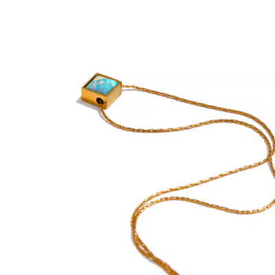 The Autumn Opal Square Pendant Necklace adds a touch of elegance to any outfit, featuring a beautiful, dainty design. The opal stone symbolizes hope and inner peace. With its non-tarnish and water-resistant properties, this necklace offers both style and durability.