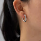 Indulge in the timeless elegance of our Celine Silver Hoop Earrings. Classic and must-have, these earrings are the perfect addition to any outfit. Elevate your style and make a statement with these exquisite hoops. You won&
