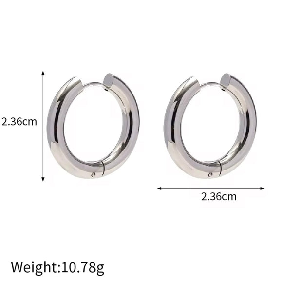 Indulge in the timeless elegance of our Celine Silver Hoop Earrings. Classic and must-have, these earrings are the perfect addition to any outfit. Elevate your style and make a statement with these exquisite hoops. You won't want to take them off!

Made to last! 

Tarnish and Water Resistant, Beach & Shower friendly, Hypoallergenic

23mm x 23mm 

316L Stainless Steel 

 

 