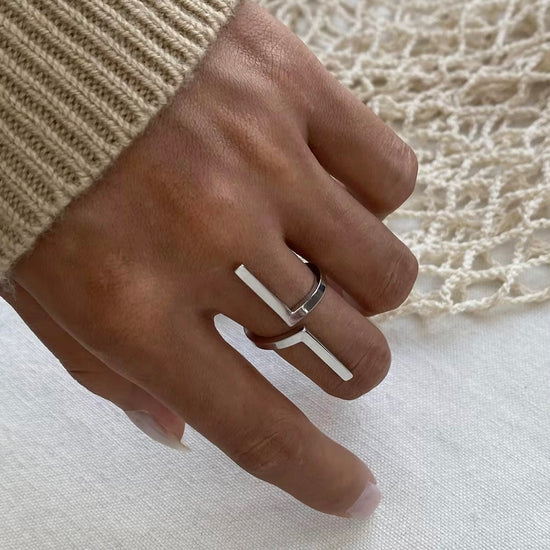 Inspire your style with our Tetris Open Ring! Embrace the geometric, unique design of this minimalistic piece. Stand out from the crowd with a touch of modernity and sophistication. Elevate any outfit and make a statement with this one-of-a-kind ring.

Metal:&nbsp; Stainless Steel

Hypoallergenic &amp; Water Resistant

Size: Adjustable Fits size 8/9