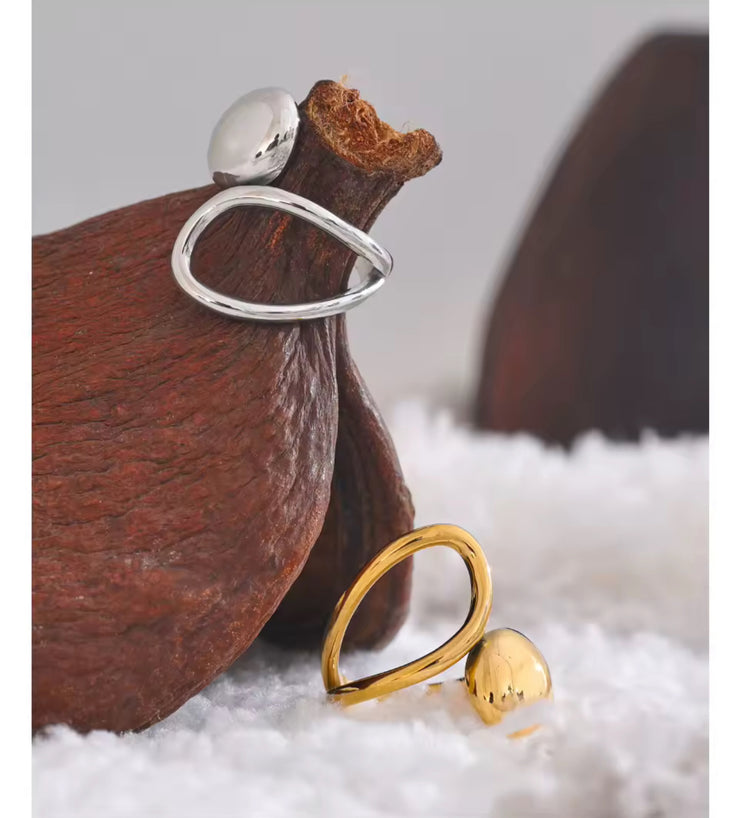 Experience the art of modern luxury with our Galiya Open Ring. The abstract open design creates a sophisticated and exclusive statement piece, sure to start conversations. Elevate your style and be the center of attention with this uniquely elegant ring.

Fits SIZE - 6/7/8 Adjustable

Stainless Steel 18K Gold PVD Plated - Made to last!

Hypoallergenic, Tarnish free 
