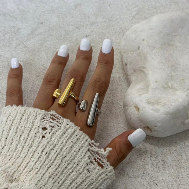 Davina Ring XMTX Collections close up on a hand gold and silver waterproof geometric style ring