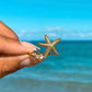 Get ready to embrace the everlasting summer vibes with our Double Starfish Open Ring! This ring is the perfect addition to your ring stack, adding a touch of coastal charm. Say goodbye to boring rings and say hello to endless possibilities and beachy memories. Order now and let the summer never end!

SIZE - Open

Stainless Steel 18K Gold PVD Plated - Made to last!

Hypoallergenic, Tarnish 