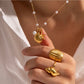 Discover the perfect accessory for any beach lover with our Under the Sea Necklace. This beachy necklace will transport you to forever summer vibes with its charming shell, starfish, and pearl charms. Embrace your inner mermaid and add a touch of whimsy to any outfit.

.

Made to last!&nbsp;Tarnish and Water Resistant, Hypoallergenic

16" long +2" ext

Closure : Lobster Clasp




18k Gold PVD Plated over 316L Stainless Steel base