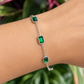 Reese Bracelet with emerald green stones worn on the wrist