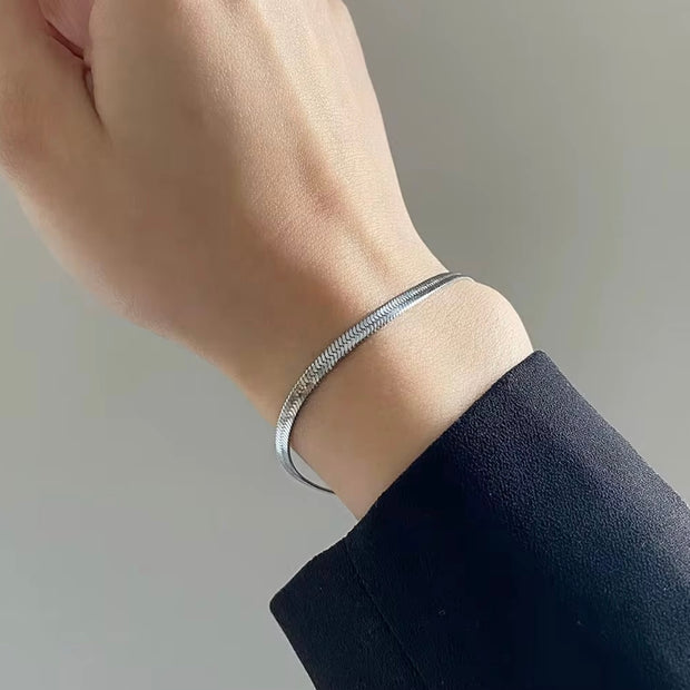 Elevate your look at the beach or pool this summer with the dainty herringbone style bracelet. Perfect for stacking or wearing alone. 

This piece is made to last, hypoallergenic  & waterproof.

316L Stainless Steel 18K Gold Plated

6.5 inches long +2 inches ext/ 4 mm wide