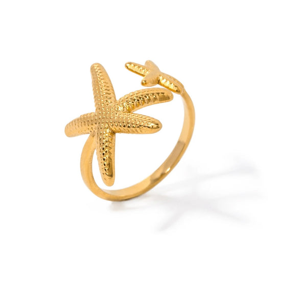 Get ready to embrace the everlasting summer vibes with our Double Starfish Open Ring! This ring is the perfect addition to your ring stack, adding a touch of coastal charm. Say goodbye to boring rings and say hello to endless possibilities and beachy memories. Order now and let the summer never end!

SIZE - Open

Stainless Steel 18K Gold PVD Plated - Made to last!

Hypoallergenic, Tarnish free&nbsp;