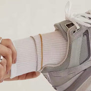 Thin Cuban Link Anklet XMTX Collections shown on a leg with a sneaker on