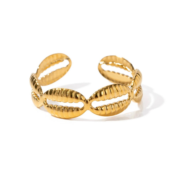 Capture the essence of summer with our Shells Open Ring! Reminisce on beach memories every time you wear it. Let this stylish design inspire your love for the sea.

Metal: 18K Gold over Stainless Steel

Hypoallergenic &amp; Water Resistant

Size: Adjustabl