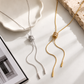 Gold and silver Alana Slider Long Necklaces displayed together showing adjustable slider design