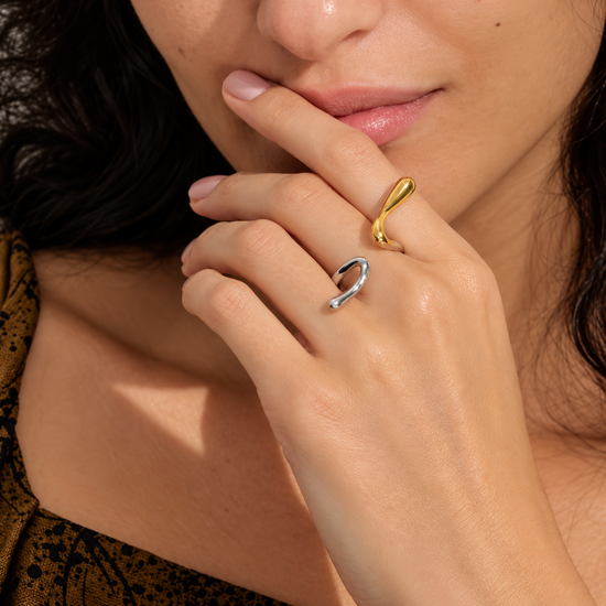 Anya two tone geometric open-ended ring in gold and silver worn on hand
