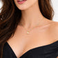 Model wearing dainty gold turquoise beaded April necklace with small pendant
