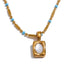 Close-up of April gold necklace showing small pendant and turquoise beads