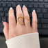 Billy Geometric Double Ring in gold worn on hand over keyboard – waterproof geometric statement ring