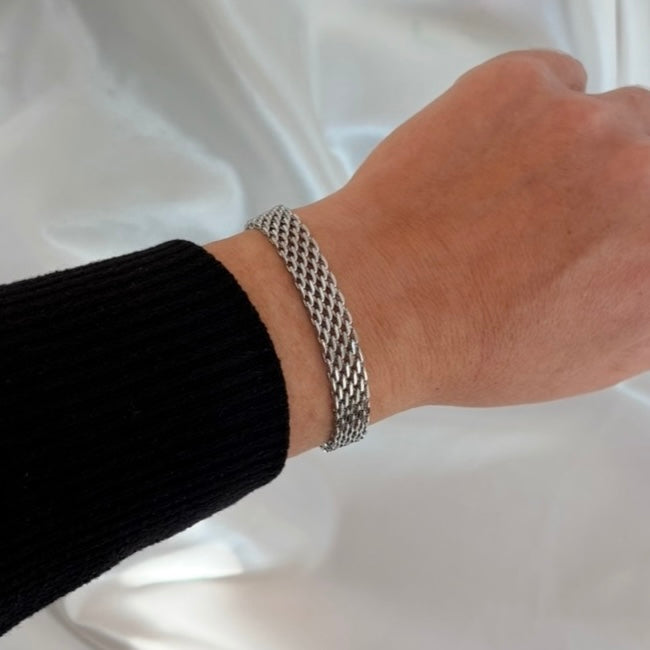 Silver Bria Woven Bracelet layered stainless steel bracelet on wrist