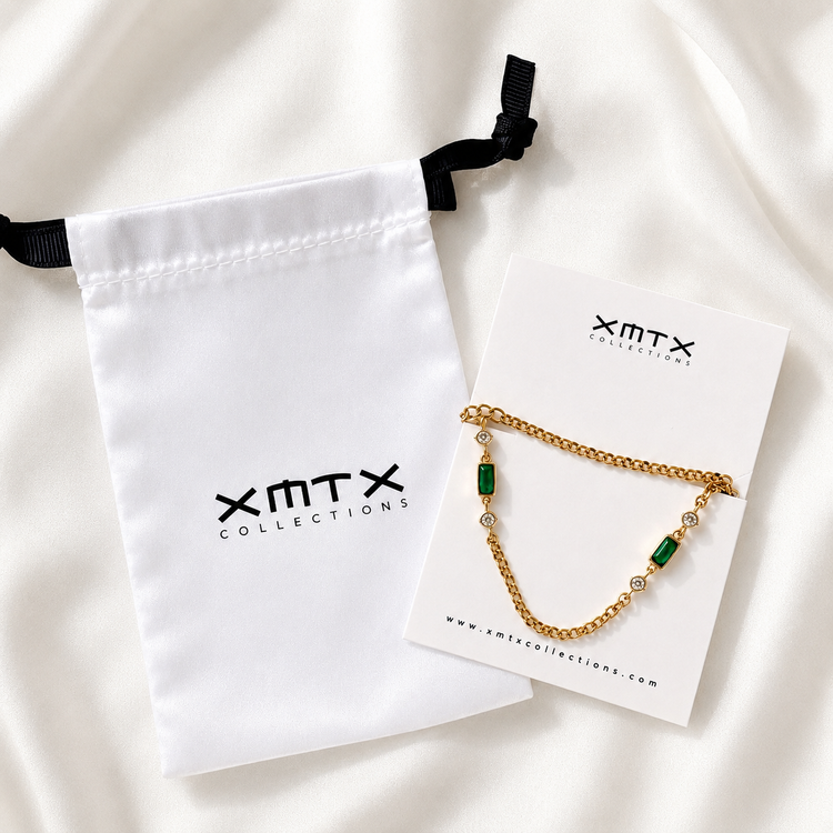 Brielle waterproof emerald-green necklace displayed on an XMTX Collections jewelry card with branded satin pouch