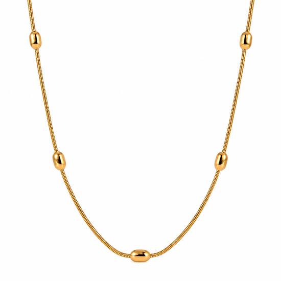 Gold snake chain necklace with oval bead accents on a white background