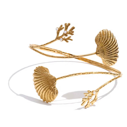 Gold Corals & Shells Upper Arm Cuff Bracelet in polished stainless steel with coral and shell design on a white background