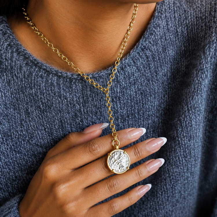 Close-up of the Dawn gold pendant necklace highlighting the sun-inspired design