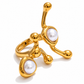 Ellen Modern Ring featuring a sculptural gold design and two glossy faux pearl accents on a white background.