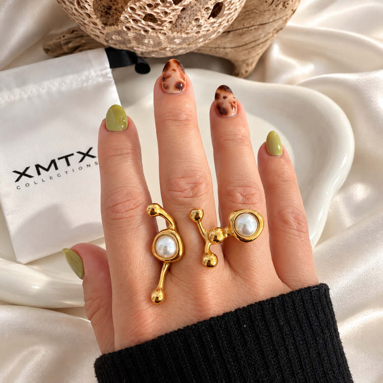 Ellen Modern gold faux pearl statement ring shown worn on a hand