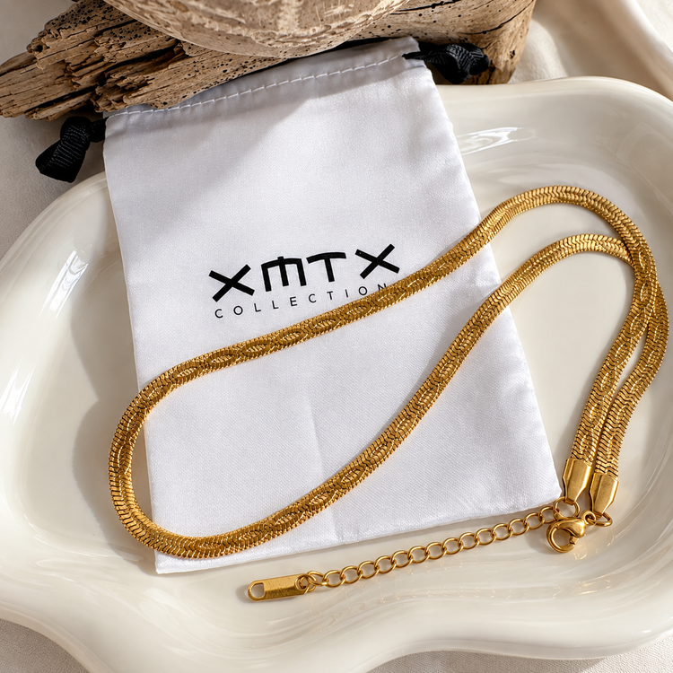 Embossed Herringbone Necklace styled with XMTX Collections jewelry pouch, waterproof non-tarnish gold jewelry