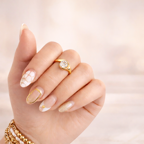 Gold bezel Emily ring on hand with neutral manicure, waterproof non-tarnish everyday jewelry by XMTX Collections