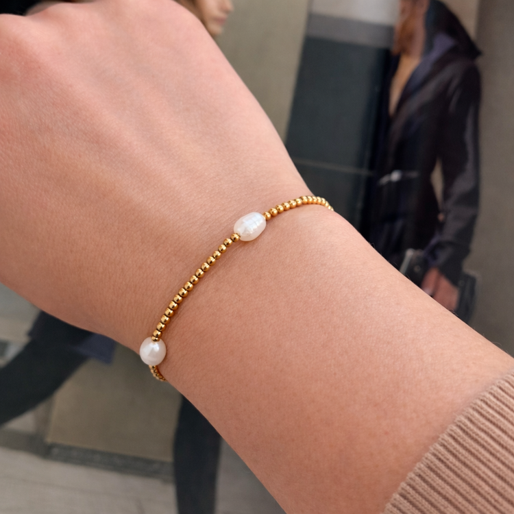 Minimal freshwater pearl bracelet on wrist