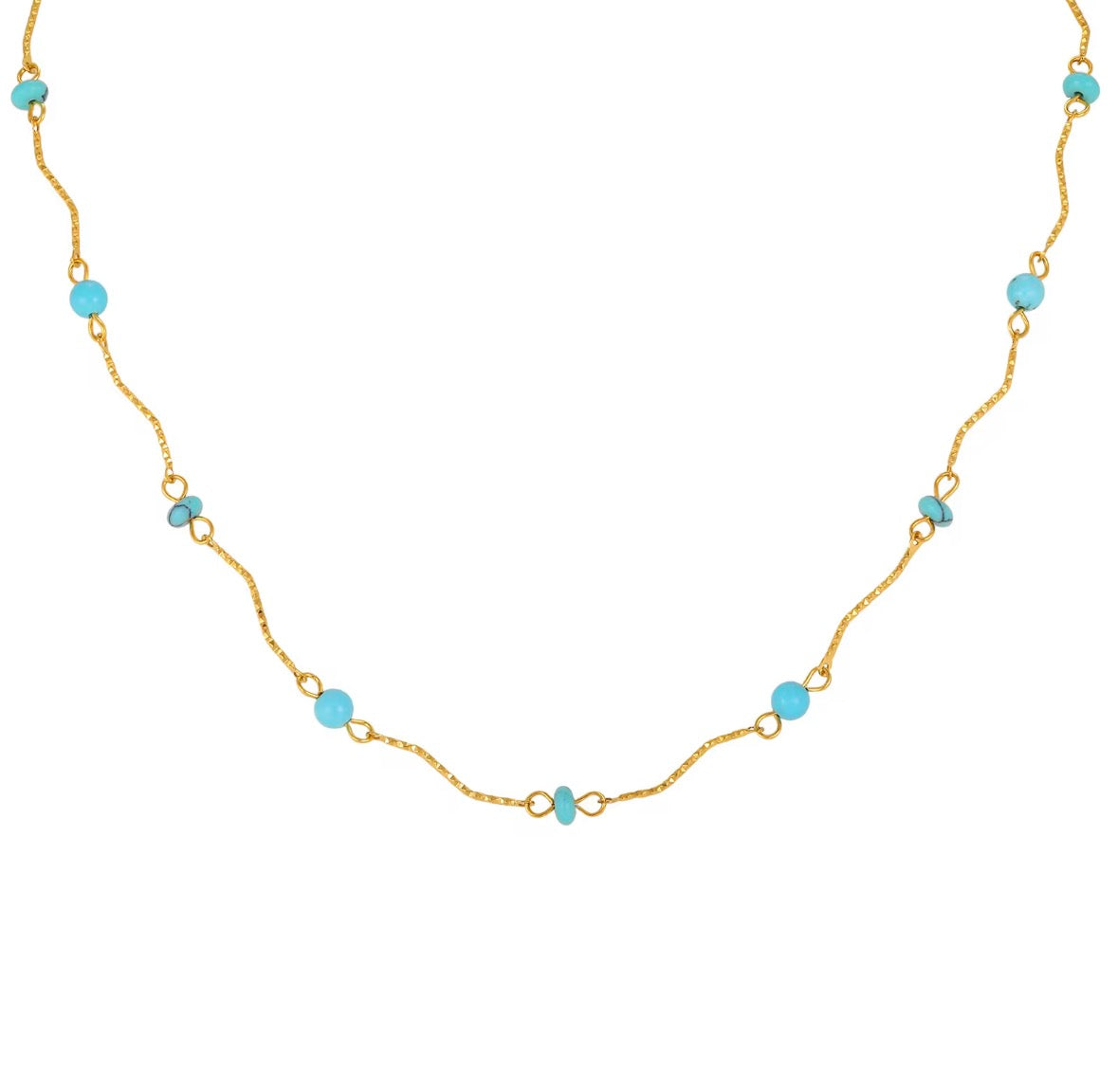 A delicate gold chain necklace featuring small, evenly spaced light blue beads on a plain white background.